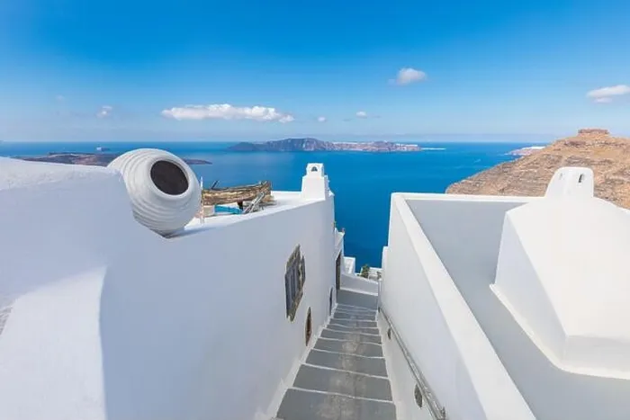 Framed Print : Peaceful view in Santorini, Greece with white architecture flowers. Mediterranean summer mood, vacation and travel background. Luxury destination Framed Print : Peaceful view in Santorini, Greece with white architecture flowers. Mediterranean summer mood, vacation and travel background. Luxury destination