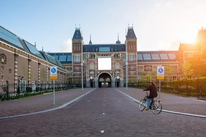 Framed Print : People on bicycles passing by Rijksmuseum (Netherlands National state museum) in Amsterdam, Netherlands. Bicycle - the main means of transportation in Framed Print : People on bicycles passing by Rijksmuseum (Netherlands National state museum) in Amsterdam, Netherlands. Bicycle - the main means of transportation in