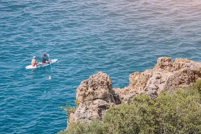 Framed Print : Two people rowing on kayak or sap board swim and travel along the coastal sea zone at the resort Framed Print : Two people rowing on kayak or sap board swim and travel along the coastal sea zone at the resort