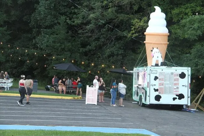 Framed Print : People waiting in line in front of an ice cream truck in the U.S.A Framed Print : People waiting in line in front of an ice cream truck in the U.S.A