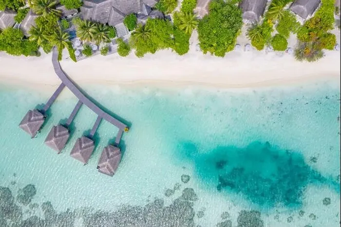 Framed Print : Perfect aerial landscape, luxury tropical resort or hotel with water villas and beautiful beach scenery. Amazing bird eyes view in Maldives, landscape Framed Print : Perfect aerial landscape, luxury tropical resort or hotel with water villas and beautiful beach scenery. Amazing bird eyes view in Maldives, landscape