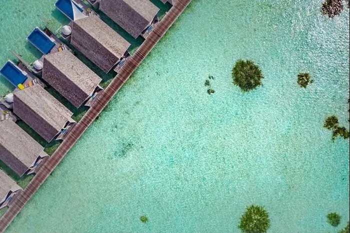 Framed Print : Perfect aerial landscape, luxury tropical resort or hotel with water villas and beautiful beach scenery. Amazing bird eyes view in Maldives, landscape