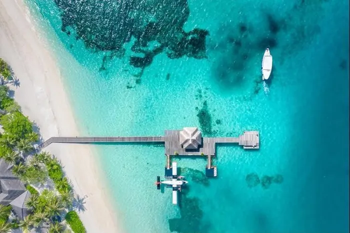 Framed Print : Perfect aerial landscape, luxury tropical resort or hotel with water villas and beautiful beach scenery. Amazing bird eyes view in Maldives, landscape Framed Print : Perfect aerial landscape, luxury tropical resort or hotel with water villas and beautiful beach scenery. Amazing bird eyes view in Maldives, landscape