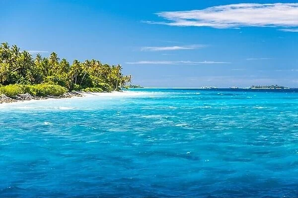Perfect tropical island paradise beach with amazing ocean lagoon, waves under blue sky
