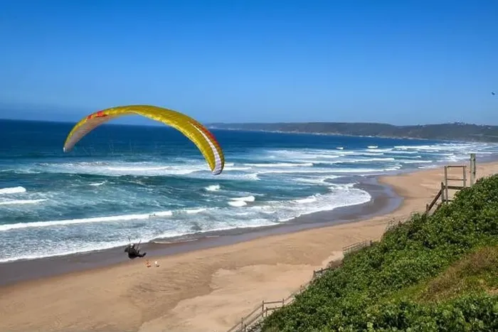Framed Print : Person flying his paraglider on the beach of Wilderness in South Africa Framed Print : Person flying his paraglider on the beach of Wilderness in South Africa