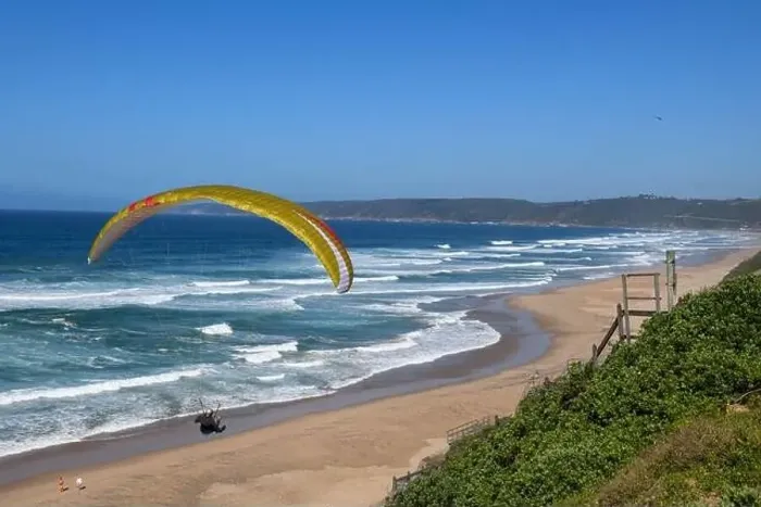 Framed Print : Person flying his paraglider on the beach of Wilderness in South Africa Framed Print : Person flying his paraglider on the beach of Wilderness in South Africa