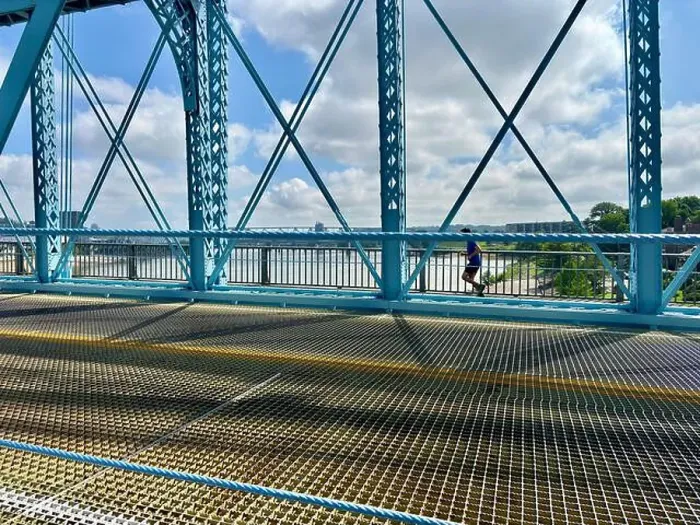 Framed Print : Person jogging on Roebling Bridge in Cincinnati, OH with river view Framed Print : Person jogging on Roebling Bridge in Cincinnati, OH with river view