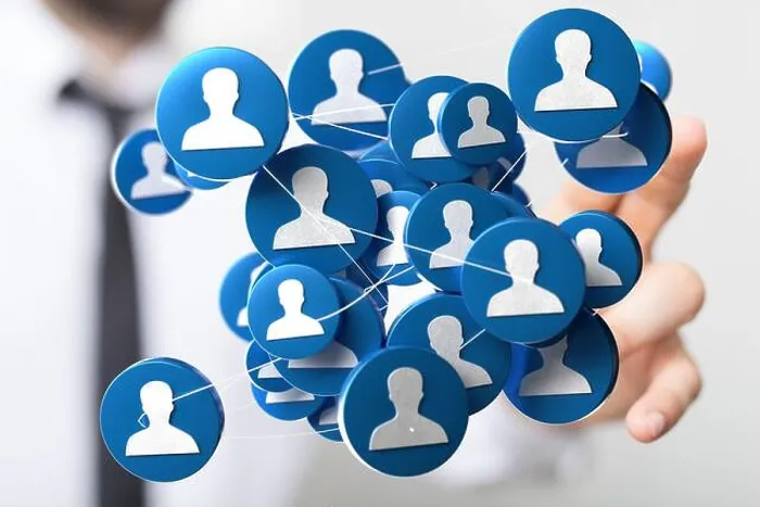Framed Print : Person's hand touching 3D rendered people silhouettes in the network team Framed Print : Person's hand touching 3D rendered people silhouettes in the network team