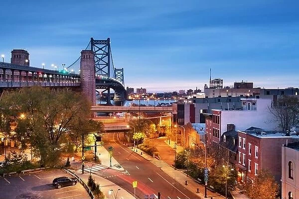 Philadelphia, Pennsylvania, USA at Benjamin Franklin Bridge spanning the Delaware River towards Camden, New Jersey