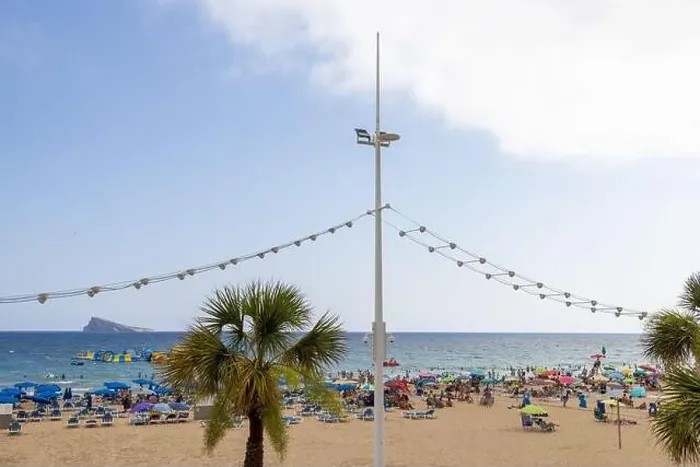 Framed Print : Photo of the famous Levante Beach in Benidorm Spain showing people having fun on the Spanish beach on a hot sunny day Framed Print : Photo of the famous Levante Beach in Benidorm Spain showing people having fun on the Spanish beach on a hot sunny day