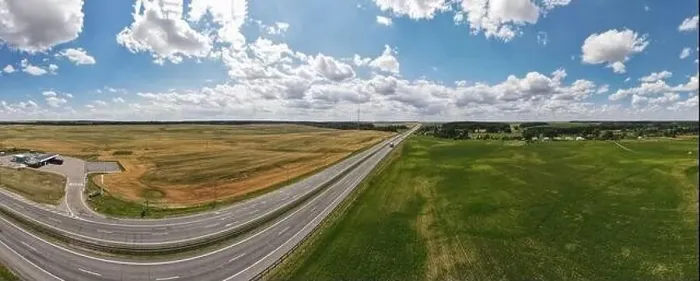 Framed Print : Photo from a flying drone, highway road on a sunny day in summer Framed Print : Photo from a flying drone, highway road on a sunny day in summer