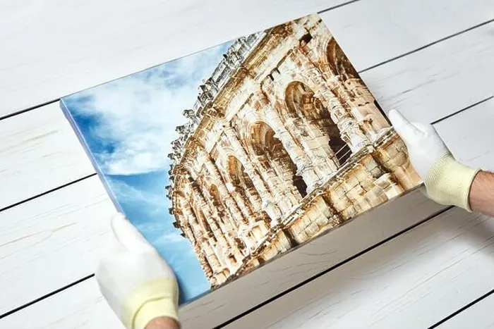 Framed Print : Photography printed on canvas with gallery wrap method of canvas stretching in male hands Framed Print : Photography printed on canvas with gallery wrap method of canvas stretching in male hands