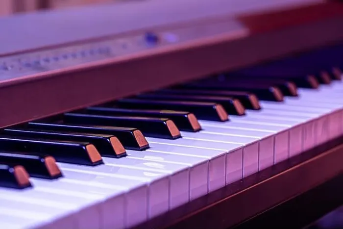 Framed Print : Piano keys on a beautiful colored background. Close up Framed Print : Piano keys on a beautiful colored background. Close up