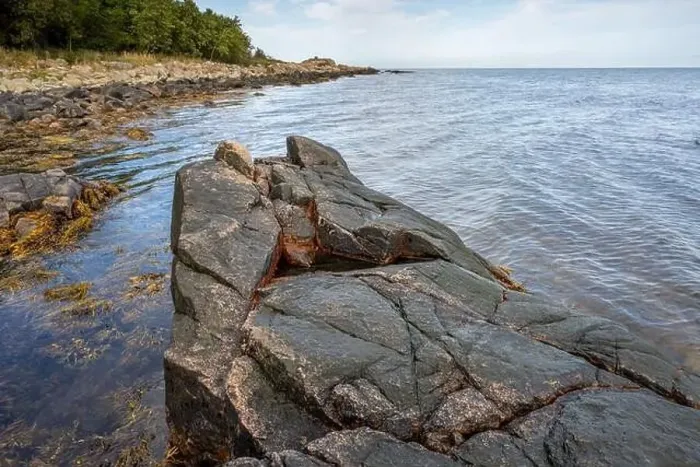 Framed Print : A picture of a rock against the blue water. Picture from Skalderviken, southern Sweden Framed Print : A picture of a rock against the blue water. Picture from Skalderviken, southern Sweden