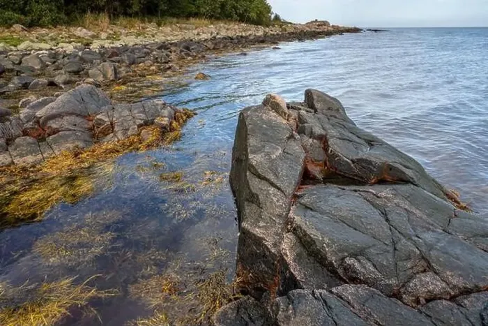 Framed Print : A picture of a rock against the blue water. Picture from Skalderviken, southern Sweden Framed Print : A picture of a rock against the blue water. Picture from Skalderviken, southern Sweden