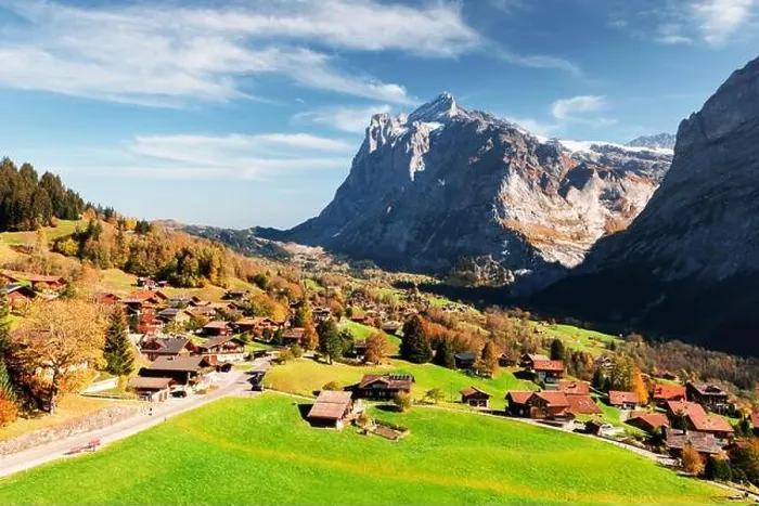 Framed Print : Picturesque autumn landscape in Switzerland mountains. Yellow leaves and wooden houses in Grindelwald village in Swiss Alps Framed Print : Picturesque autumn landscape in Switzerland mountains. Yellow leaves and wooden houses in Grindelwald village in Swiss Alps