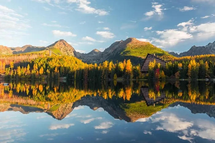 Framed Print : Picturesque autumn view of lake Strbske pleso in High Tatras National Park, Slovakia. Clear water with reflections of orange larch and high mountains Framed Print : Picturesque autumn view of lake Strbske pleso in High Tatras National Park, Slovakia. Clear water with reflections of orange larch and high mountains