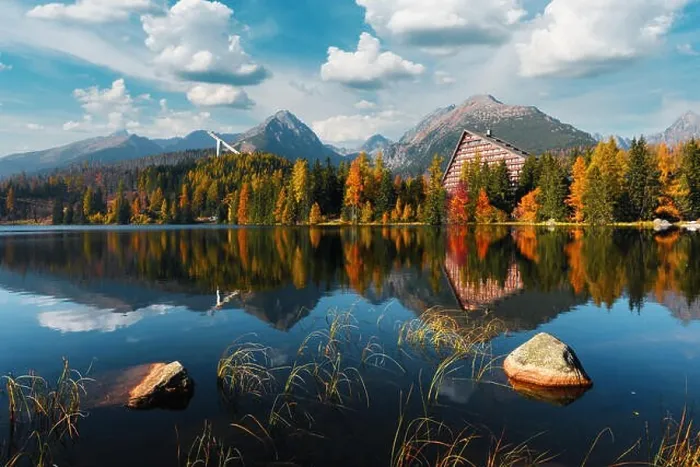 Framed Print : Picturesque autumn view of lake Strbske pleso in High Tatras National Park, Slovakia. Clear water with reflections of orange larch and high mountains Framed Print : Picturesque autumn view of lake Strbske pleso in High Tatras National Park, Slovakia. Clear water with reflections of orange larch and high mountains