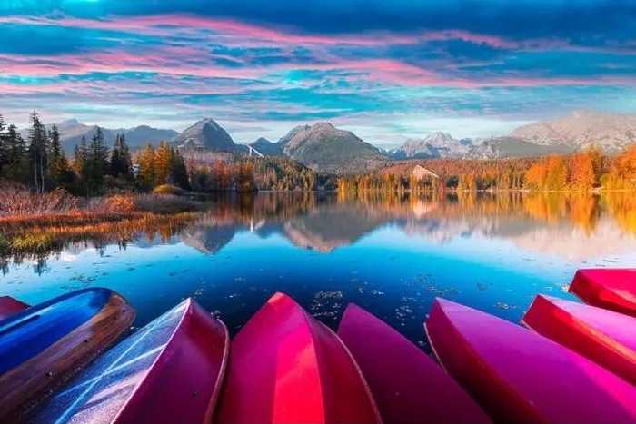 Framed Print : Picturesque autumn view of lake Strbske pleso in High Tatras National Park, Slovakia. Row of red wooden boats and high mountains on background Framed Print : Picturesque autumn view of lake Strbske pleso in High Tatras National Park, Slovakia. Row of red wooden boats and high mountains on background