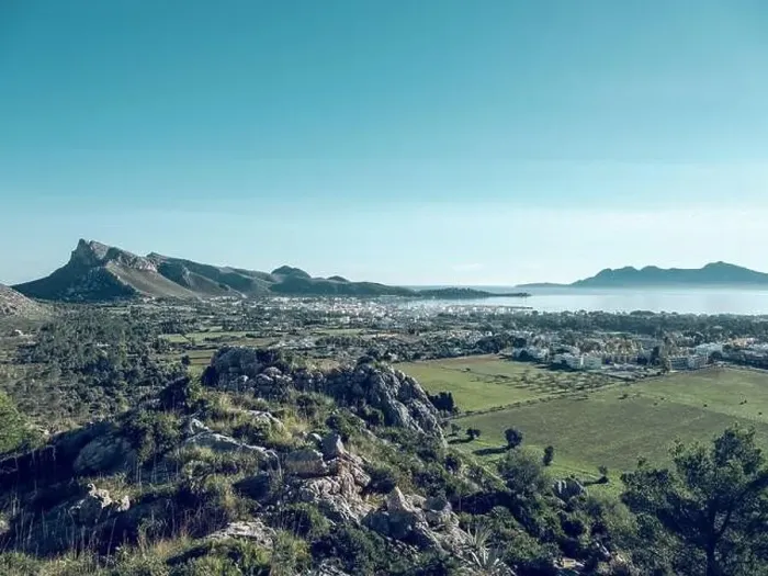 Framed Print : Picturesque drone view of Pollensa town located amidst green agricultural fields Framed Print : Picturesque drone view of Pollensa town located amidst green agricultural fields