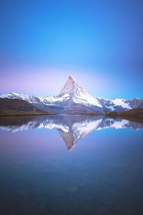 Framed Print : Picturesque landscape with colorful sunrise on Stellisee lake. Snowy Matterhorn Cervino peak with reflection in clear water. Zermatt, Swiss Alps Framed Print : Picturesque landscape with colorful sunrise on Stellisee lake. Snowy Matterhorn Cervino peak with reflection in clear water. Zermatt, Swiss Alps