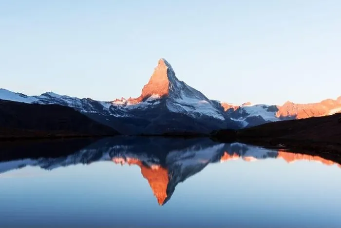 Framed Print : Picturesque landscape with colorful sunrise on Stellisee lake. Snowy Matterhorn Cervino peak with reflection in clear water. Zermatt, Swiss Alps Framed Print : Picturesque landscape with colorful sunrise on Stellisee lake. Snowy Matterhorn Cervino peak with reflection in clear water. Zermatt, Swiss Alps