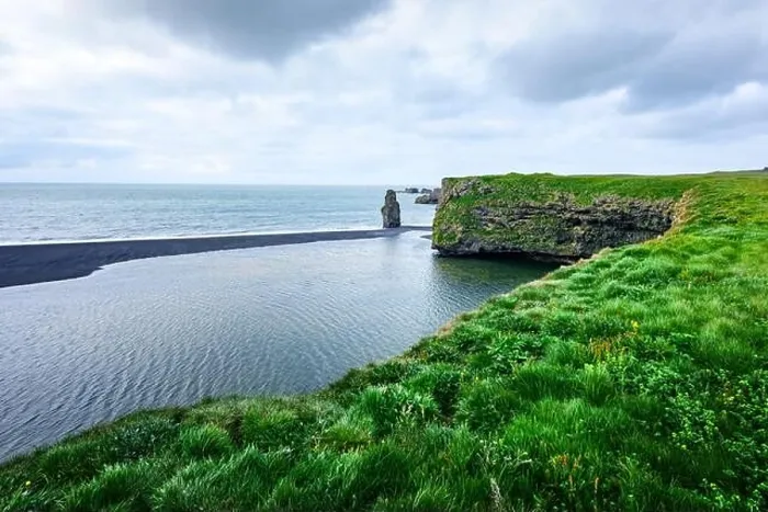 Framed Print : Picturesque landscape with green coast of Atlantic ocean in Iceland. Black beach, Reynisdrangar, Vik