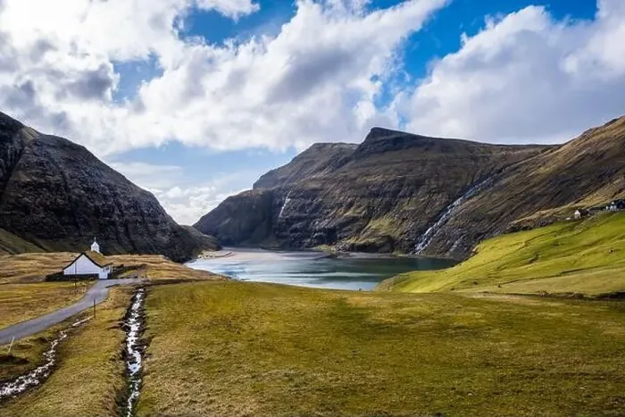 Framed Print : A picturesque path leading to a church and a lake, in Saksun, Faroe Islands Framed Print : A picturesque path leading to a church and a lake, in Saksun, Faroe Islands