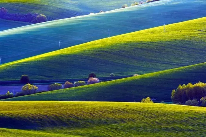 Framed Print : Picturesque rural landscape with green agricultural fields and trees on spring hills. South Moravia region, Czech Republic Framed Print : Picturesque rural landscape with green agricultural fields and trees on spring hills. South Moravia region, Czech Republic
