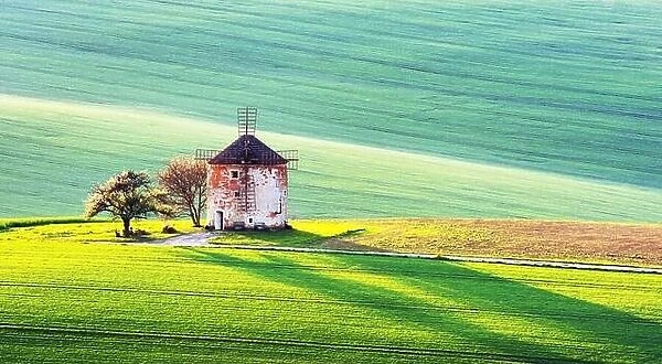 Picturesque rural landscape with old windmill