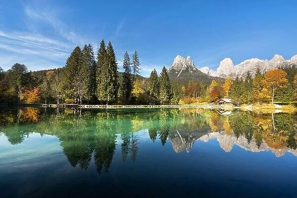 Picturesque view at autumn Welsperg lake in Dolomite Alps. Canali Valley, Primiero San Martino di Castrozza, Province of Trento, Italy