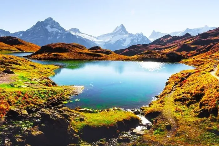 Framed Print : Picturesque view on Bachalpsee lake in Swiss Alps mountains. Snowy peaks of Wetterhorn, Mittelhorn and Rosenhorn on background Framed Print : Picturesque view on Bachalpsee lake in Swiss Alps mountains. Snowy peaks of Wetterhorn, Mittelhorn and Rosenhorn on background