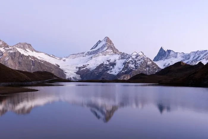 Framed Print : Picturesque view on Bachalpsee lake in Swiss Alps mountains. Snowy peaks of Wetterhorn, Mittelhorn and Rosenhorn on background. Switzerland