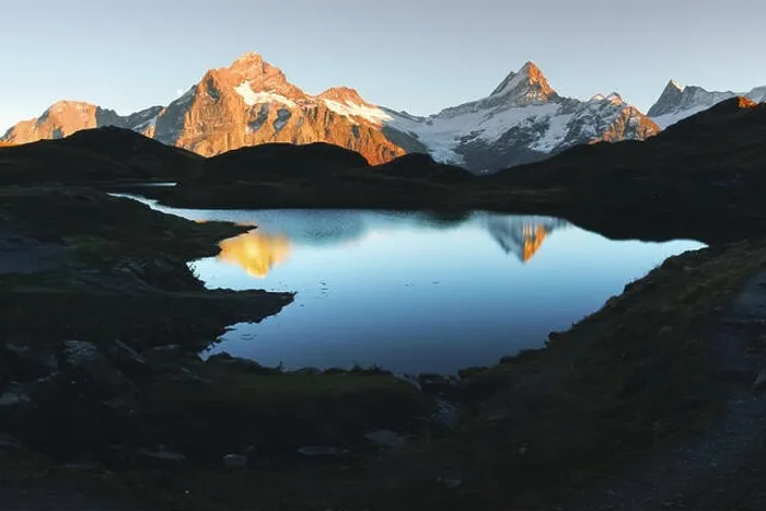 Framed Print : Picturesque view on Bachalpsee lake in Swiss Alps mountains. Snowy peaks of Wetterhorn, Mittelhorn and Rosenhorn on background. Switzerland