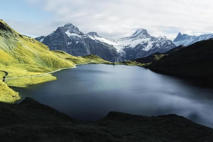 Framed Print : Picturesque view on Bachalpsee lake in Swiss Alps mountains. Snowy peaks of Wetterhorn, Mittelhorn and Rosenhorn on background. Switzerland Framed Print : Picturesque view on Bachalpsee lake in Swiss Alps mountains. Snowy peaks of Wetterhorn, Mittelhorn and Rosenhorn on background. Switzerland