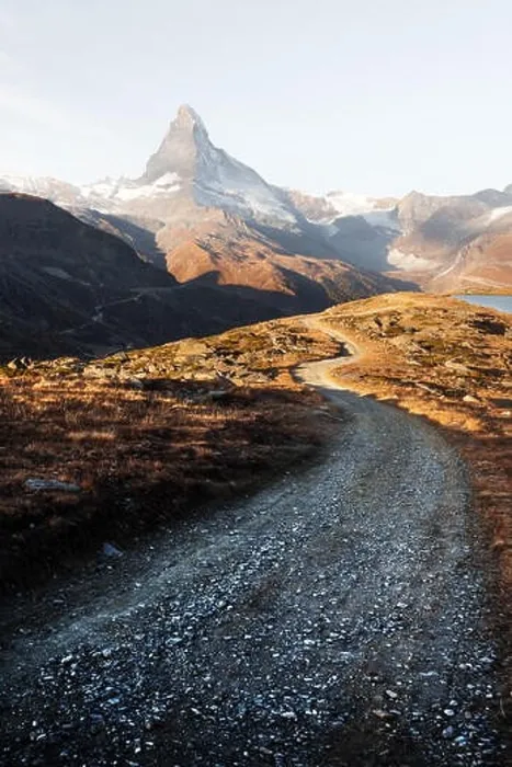 Framed Print : Picturesque view of Matterhorn Cervino peak, dirt road and Stellisee lake in Swiss Alps. Zermatt resort location, Switzerland. Landscape photography Framed Print : Picturesque view of Matterhorn Cervino peak, dirt road and Stellisee lake in Swiss Alps. Zermatt resort location, Switzerland. Landscape photography