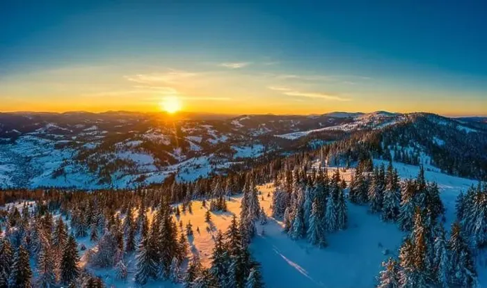Framed Print : Picturesque winter panorama of mountain hills covered with snow and fir trees on a sunny clear day with the sun Framed Print : Picturesque winter panorama of mountain hills covered with snow and fir trees on a sunny clear day with the sun