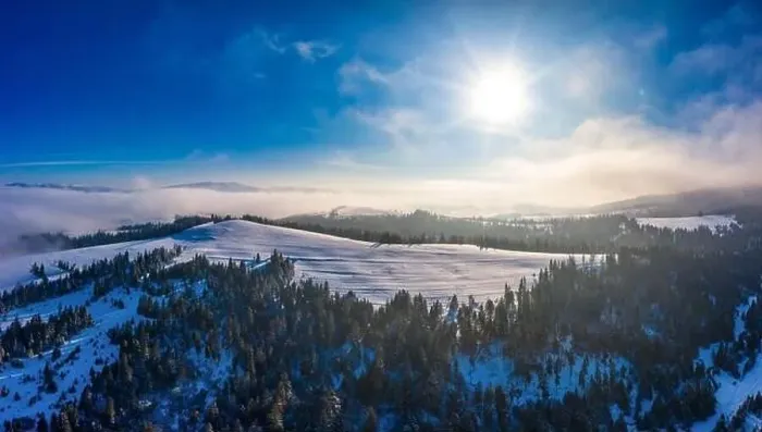 Framed Print : Picturesque winter panorama of mountain hills covered with snow and fir trees on a sunny clear day with the sun Framed Print : Picturesque winter panorama of mountain hills covered with snow and fir trees on a sunny clear day with the sun