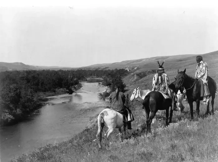 Framed Print : Three Piegan Indians and four horses on hill above river, 1910. Photograph by Edward Curtis (1868-1952) Framed Print : Three Piegan Indians and four horses on hill above river, 1910. Photograph by Edward Curtis (1868-1952)