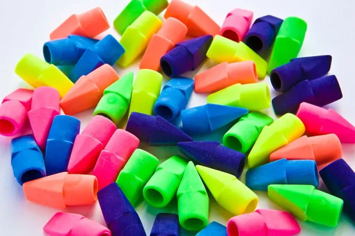 Framed Print : Pile of multi-colored pencil erasers on white background Framed Print : Pile of multi-colored pencil erasers on white background