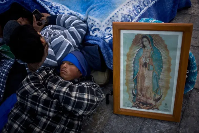 Framed Print : A pilgrim sleeps by an image of the Our Lady of Guadalupe virgin in Mexico City Framed Print : A pilgrim sleeps by an image of the Our Lady of Guadalupe virgin in Mexico City