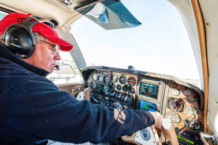 Framed Print : a pilot is doing his pre flight check before taking off in his beechcraft baron Framed Print : a pilot is doing his pre flight check before taking off in his beechcraft baron