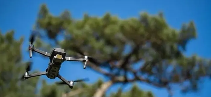 Framed Print : Piloting drone in the forest in the morning with clear blue sky Framed Print : Piloting drone in the forest in the morning with clear blue sky