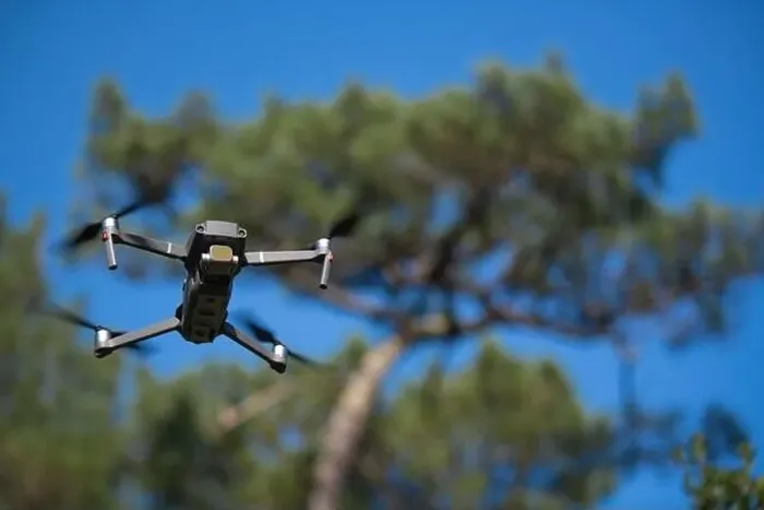 Framed Print : Piloting drone in the forest in the morning with clear blue sky Framed Print : Piloting drone in the forest in the morning with clear blue sky