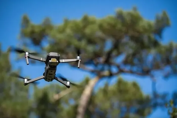 Framed Print : Piloting drone in the forest in the morning with clear blue sky Framed Print : Piloting drone in the forest in the morning with clear blue sky