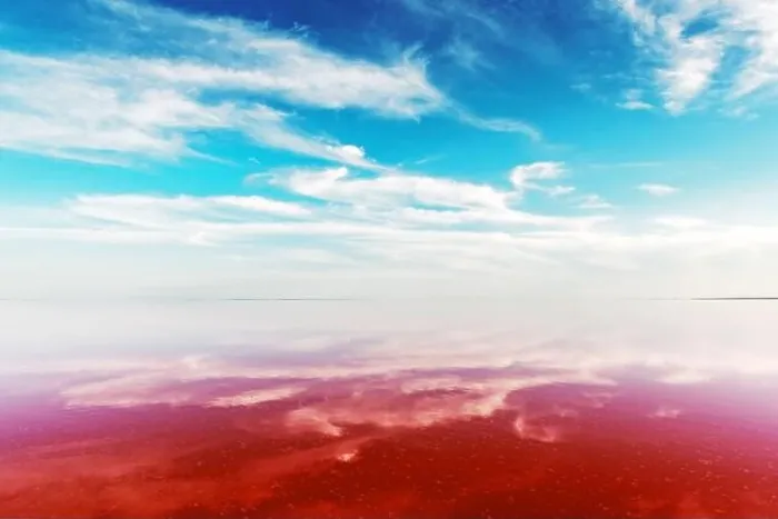 Framed Print : Pink lake water under blue sky with fluffy clouds in summer day. Creative color concept Framed Print : Pink lake water under blue sky with fluffy clouds in summer day. Creative color concept
