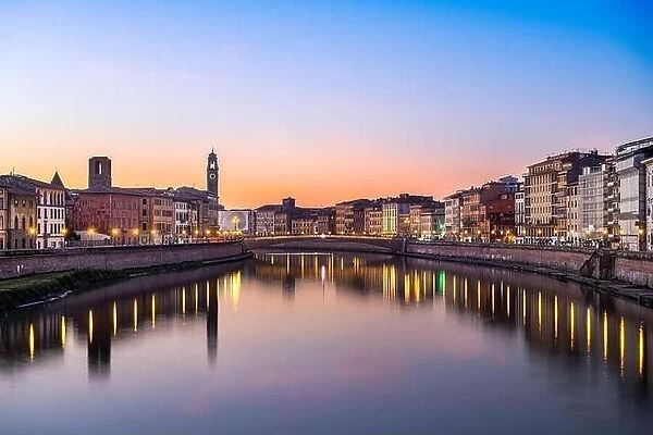Pisa, Italy skyline on the Arno River at dusk