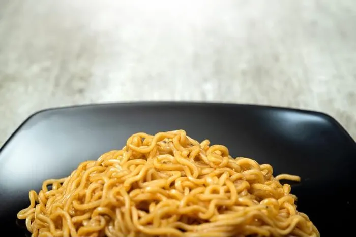 Framed Print : A plate of instant noodles sits on a table Framed Print : A plate of instant noodles sits on a table