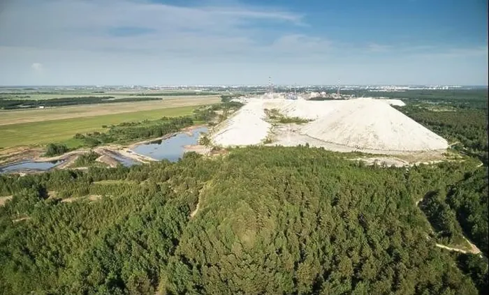 Framed Print : Poison lake with solid waste mountain aerial drone view