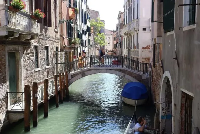Framed Print : The Ponte dei Conzafelzi bridge in Venice with people walking through it during daytime Framed Print : The Ponte dei Conzafelzi bridge in Venice with people walking through it during daytime